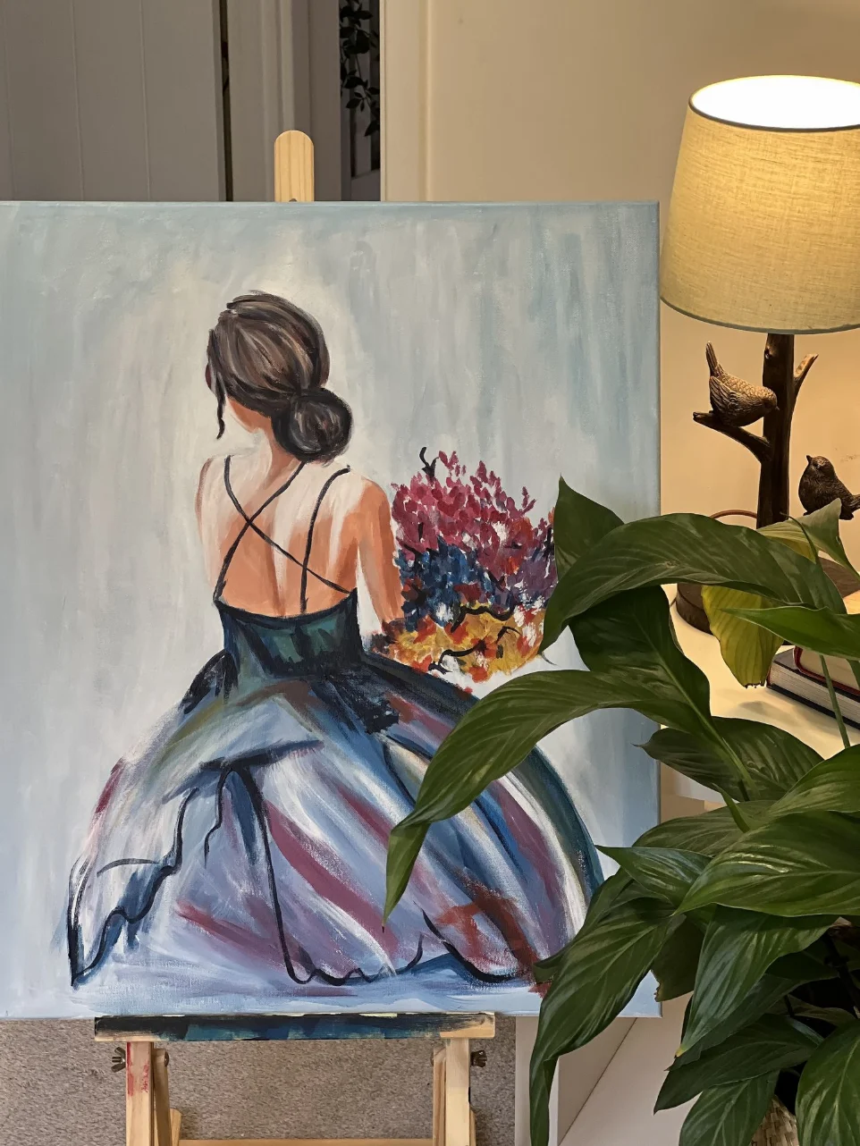 riginal hand-painted canvas artwork of a woman in a blue gown, custom created by Ahana Majumdar for luxury interior styling.