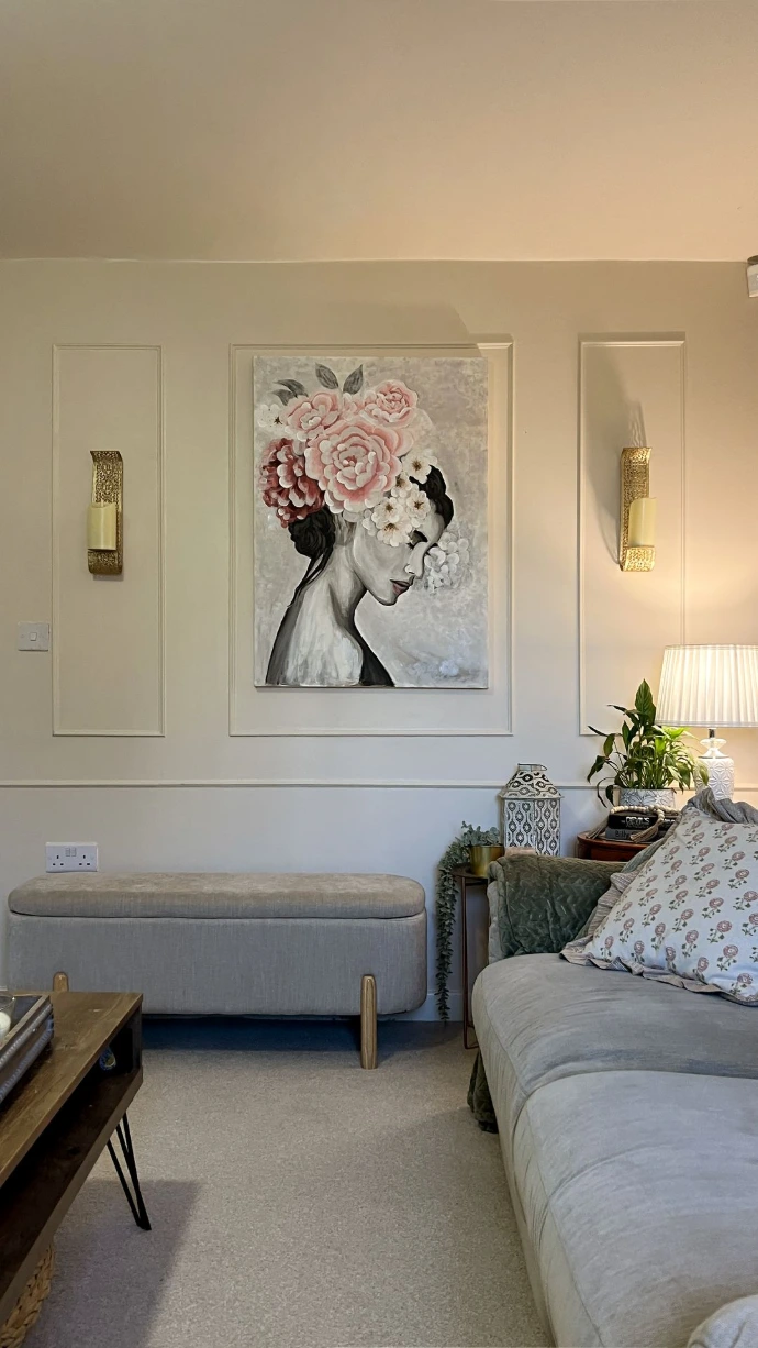 Luxury living room with design-led interiors featuring wall art and elegant furniture styling.
