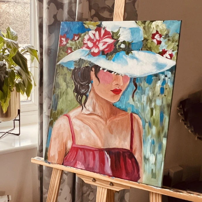Hand-painted artwork by Ahana displayed on an easel, adding a personal artistic touch to interior spaces in the UK