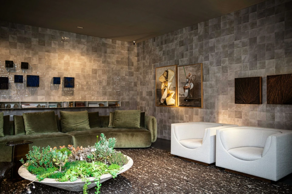 Luxury living room with green velvet sofa, armchairs and curated decor showcasing furniture sourcing and interior styling in the UK