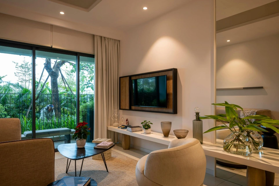 Modern living room with TV unit, soft lighting and custom decor highlighting turnkey interior installation in the UK