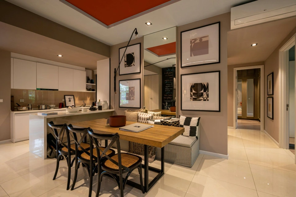 Modern dining area with wooden table, chairs and open kitchen layout showcasing turnkey interior design solutions in the UK