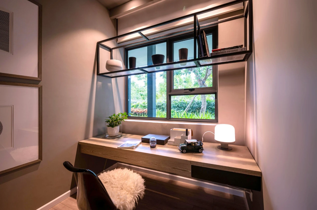 Modern home office study nook with wooden desk, shelving and window lighting showcasing smart space planning in UK homes