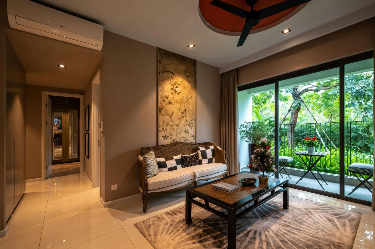 Cozy modern living room with wooden sofa, coffee table and balcony view highlighting complete home interior design in the UK