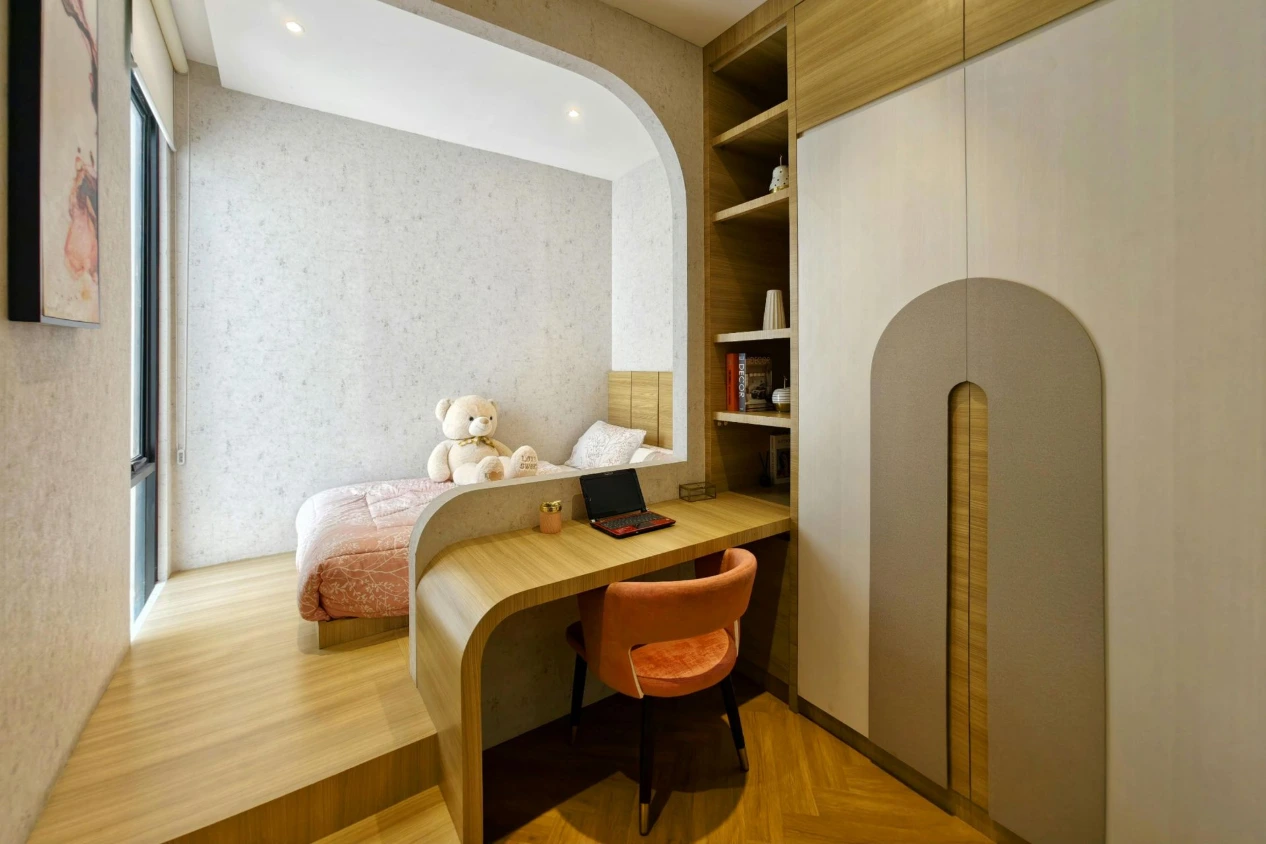 Compact bedroom with integrated workspace, wardrobe and minimalist design highlighting efficient interior planning in the UK
