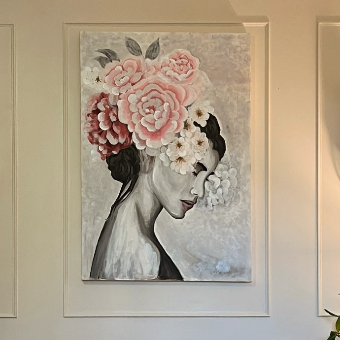 Bespoke floral woman portrait canvas art with soft pink tones, hand-painted artwork styled in a luxury interior setting in the UK